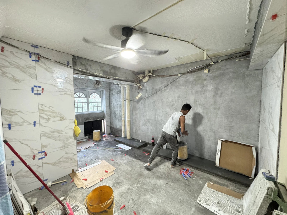 Wall tiling in progress on an RCS renovation site